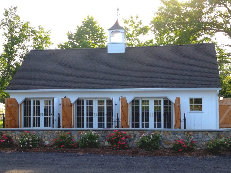 Red Barn with a blue sky and an American Flag
