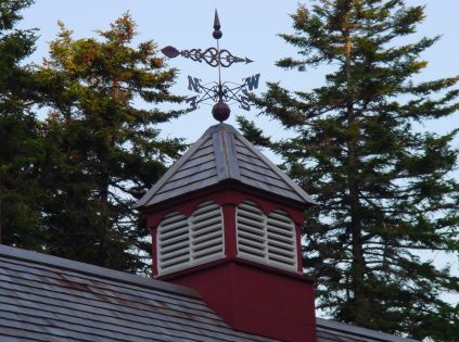 louvered cupola with copper weathervane