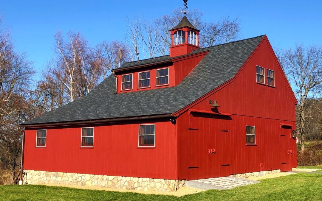 Red Post and Beam Barn with a Shed Dormer and Cupola