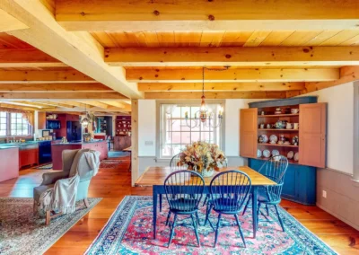 Dining room with exposed wooden beams and wood floors