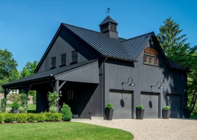 Two story charcoal barn with three garages